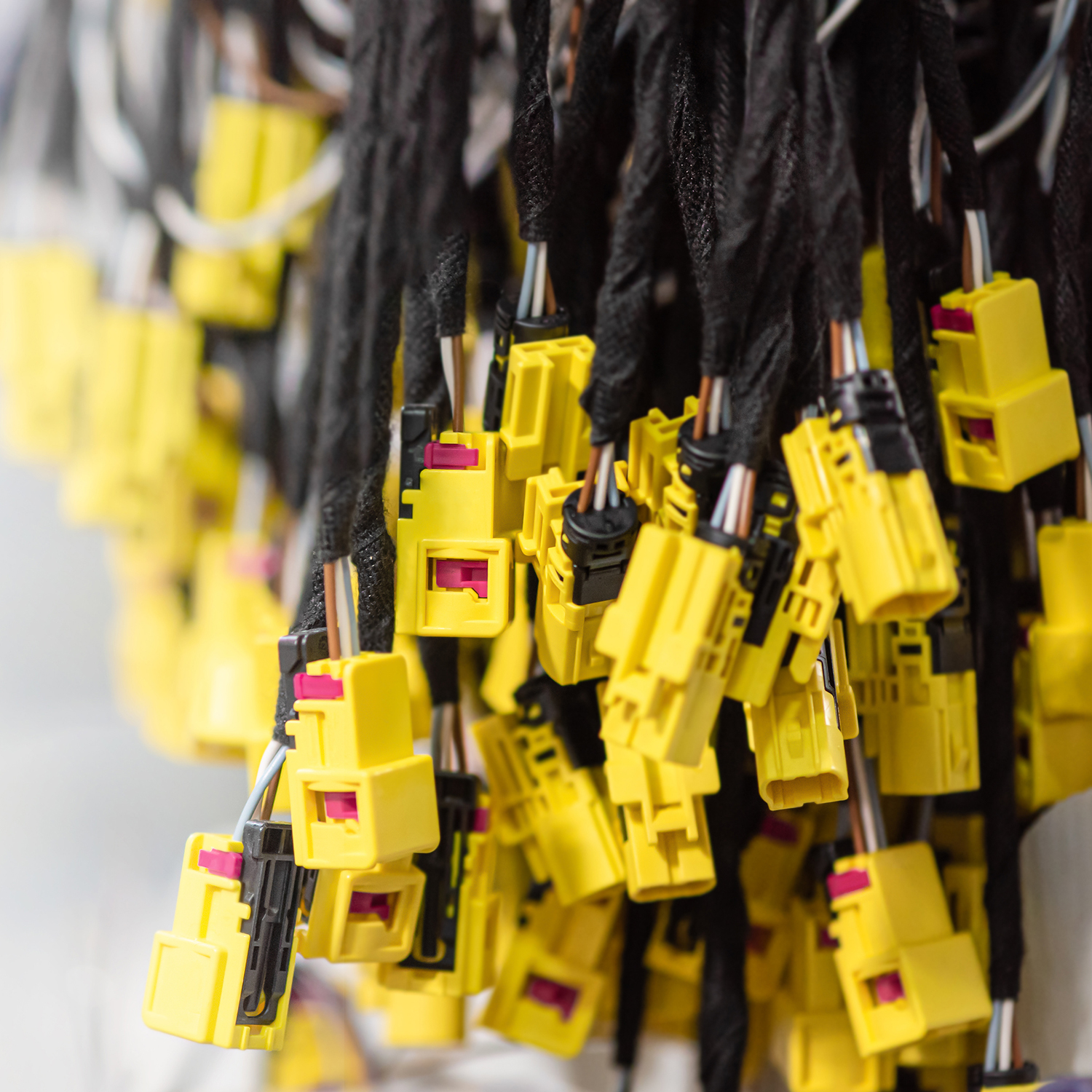 Wiring harnesses, automobile industry, production. Industrial background with copy space, banner